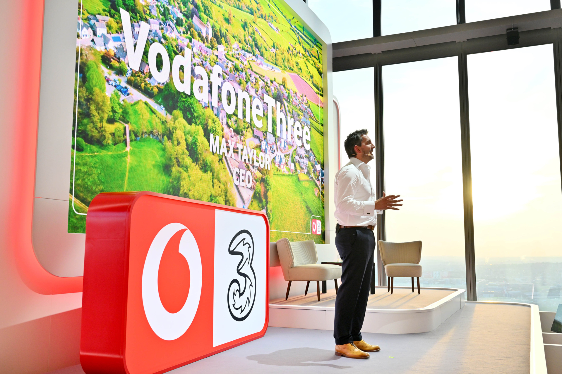 Max Taylor, CEO of VodafoneThree, speaks at the launch event marking the merger of Vodafone UK and Three UK.
